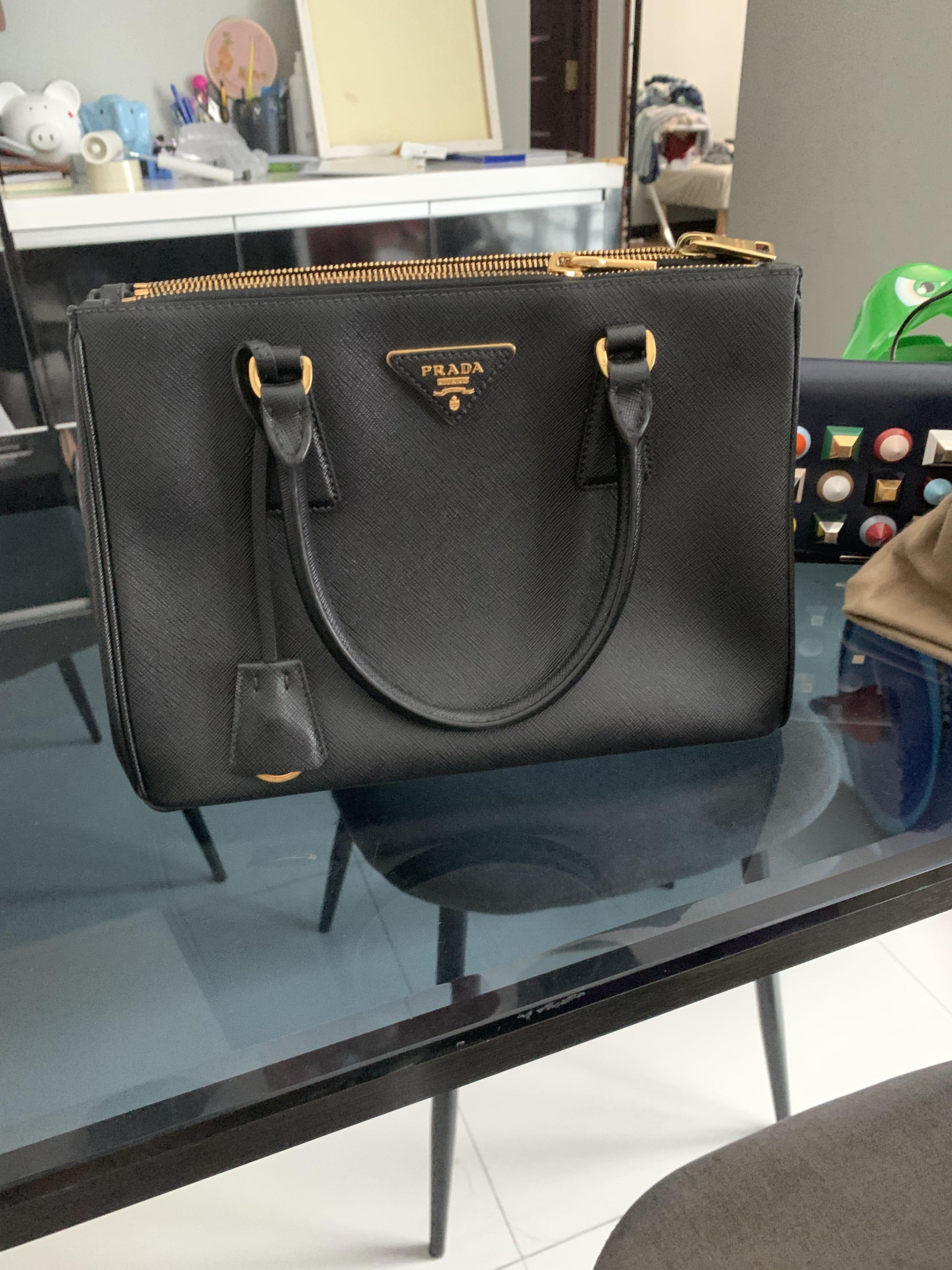 Prada (Category: Tote Bags) located in Singapore. Submitted by joyjoyw (Listing ID 259478633, Image 4). Description: Used less than 2 times. Cos I have a gray one so this one no time to use ..