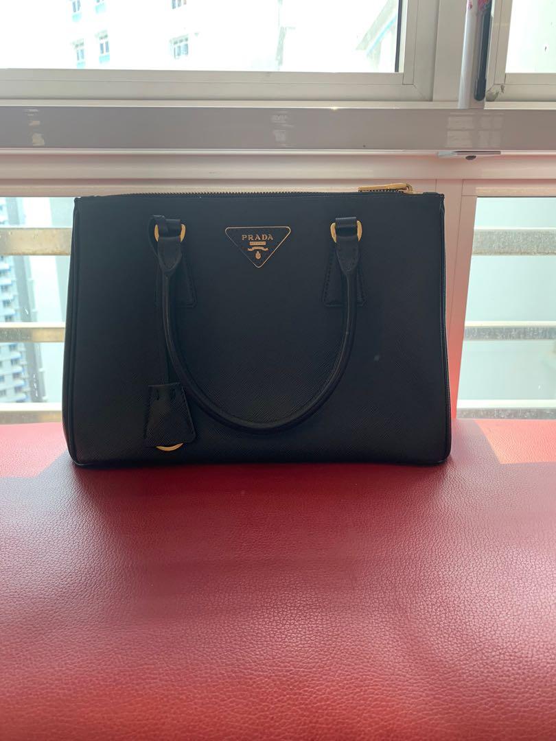 Prada (Category: Tote Bags) located in Singapore. Submitted by joyjoyw (Listing ID 259478633, Image 3). Description: Used less than 2 times. Cos I have a gray one so this one no time to use ..