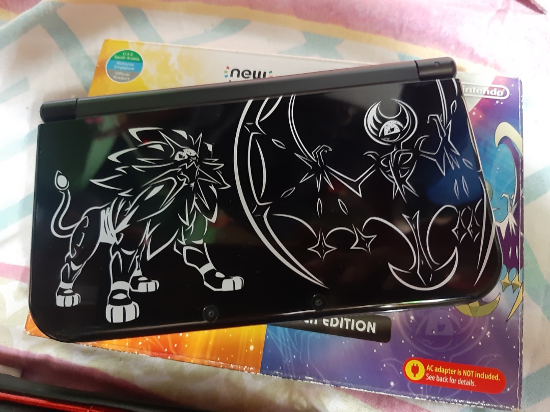 New Nintendo 3ds XL Solgaleo lunala black edition with 2 game cartridge