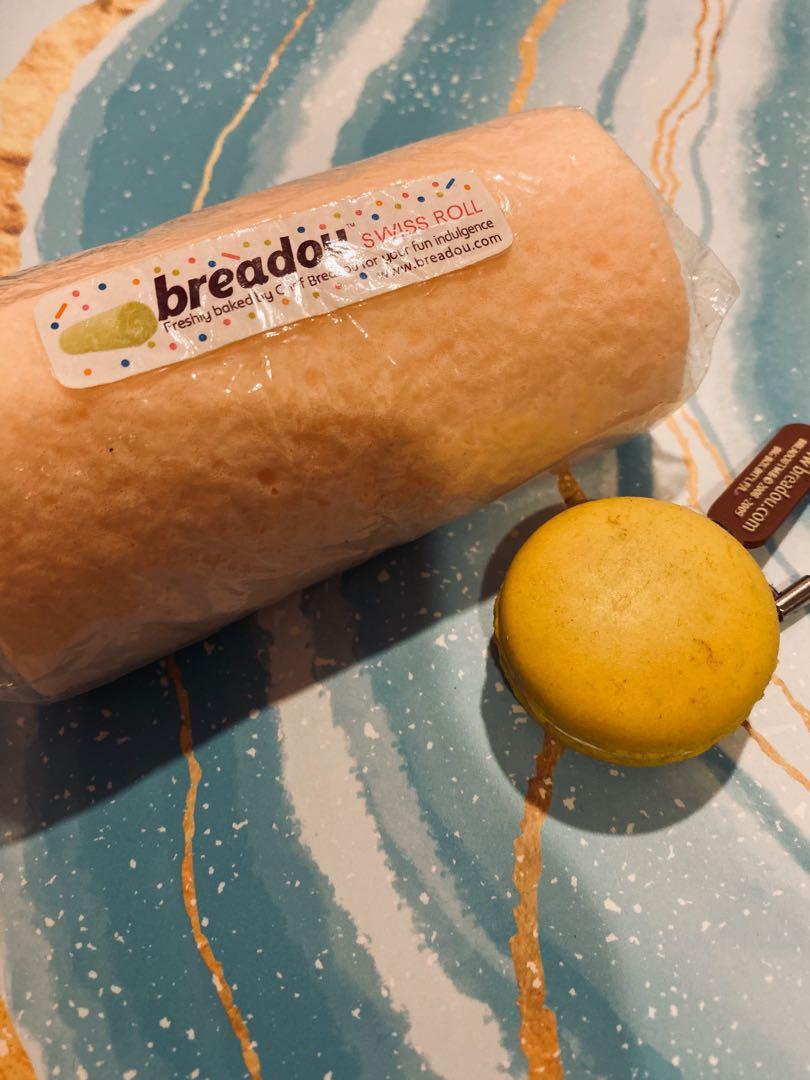 breadou set! (Category: Homemade Bakes) located in Singapore. Submitted by bloopsies (Listing ID 260570169, Image 1). Description: 1) breadou orange swiss cake roll ( in original packaging ) 2) NONREPRO yellow macaron (rare) w/o packaging cake roll no defects face of macaron is faded tags: tagged soft slowrising squish cute op.