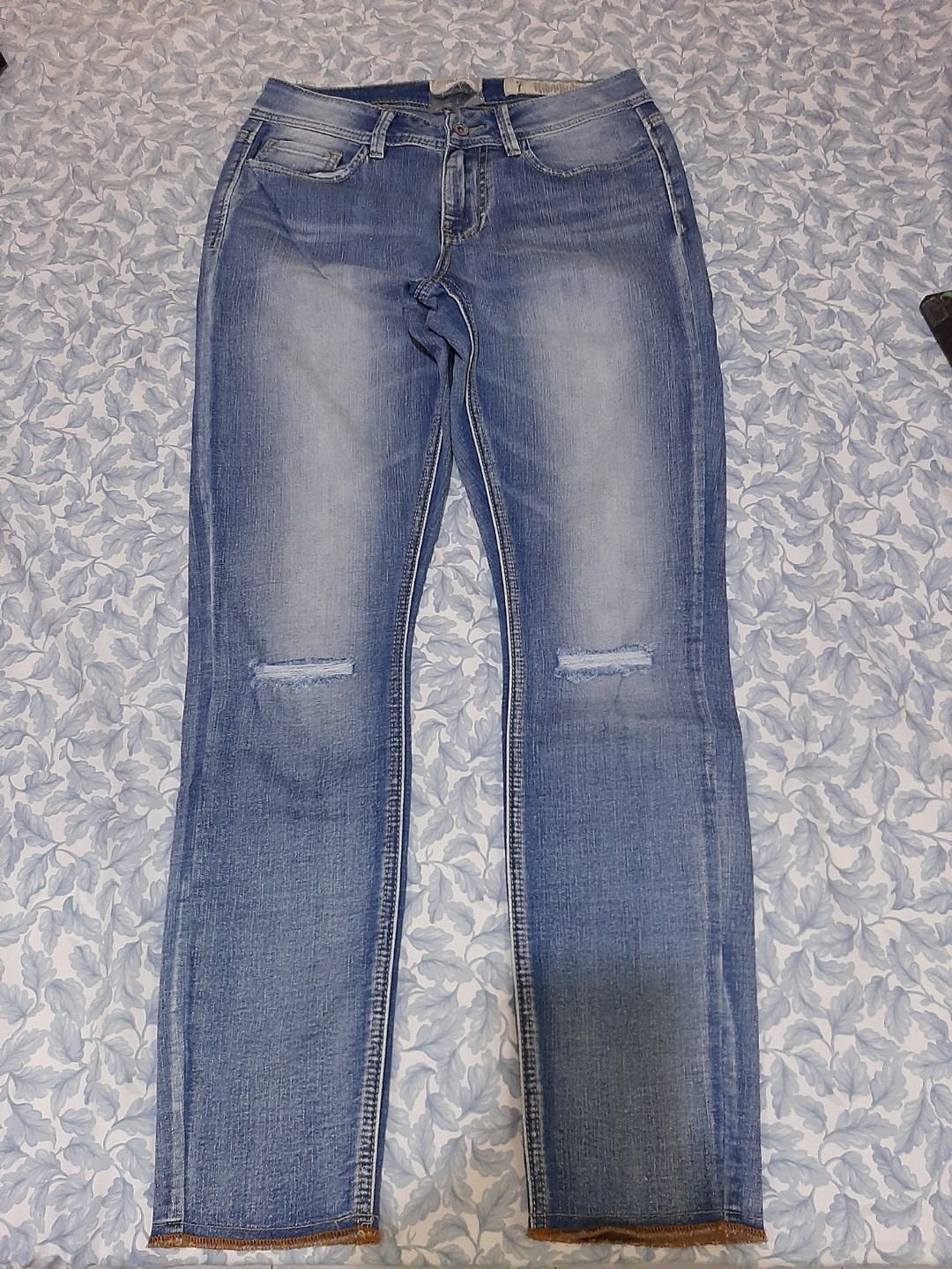 ripped jeans and knee high boots