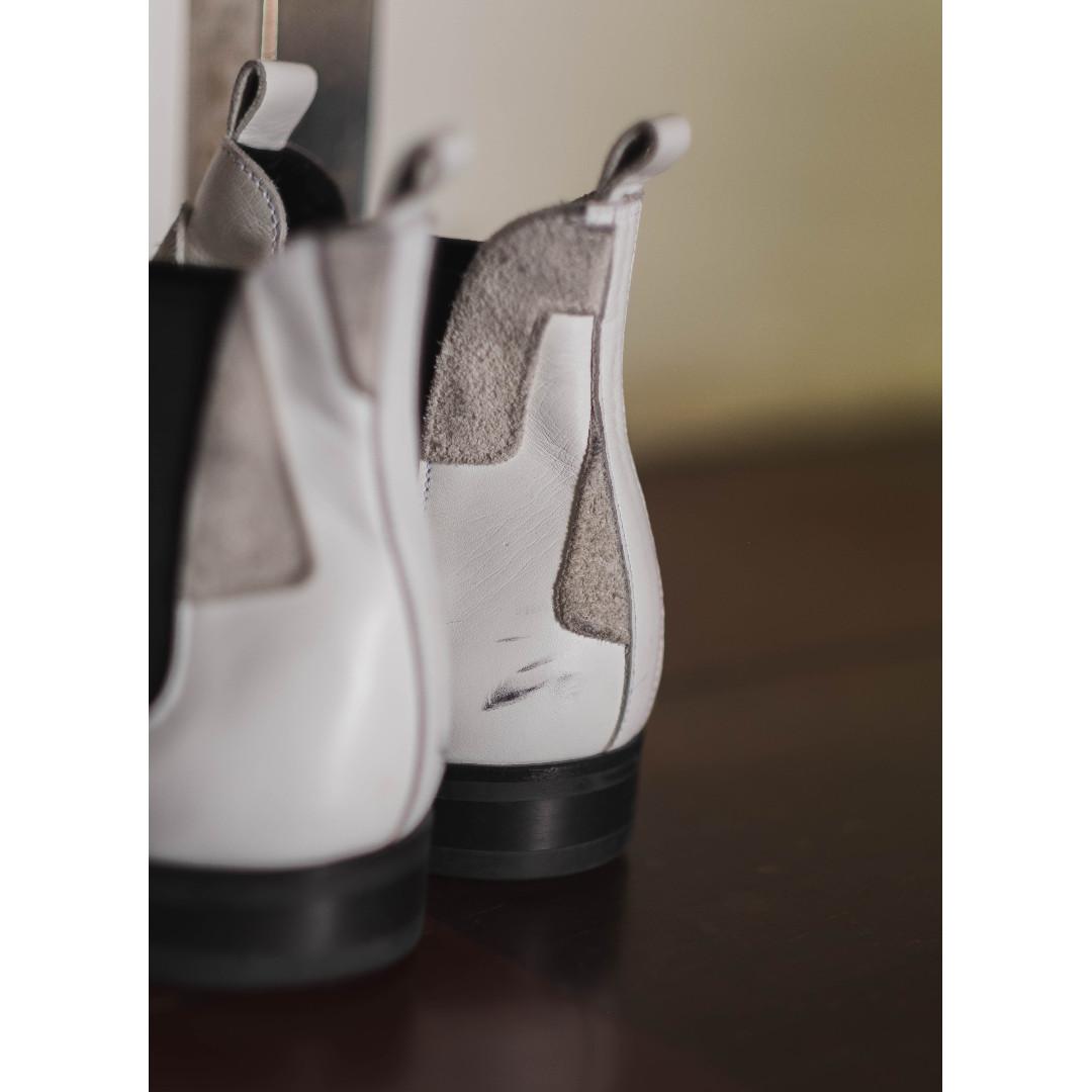 Comme Des Garcons Homme Plus Cutout Chelsea Boots (Category: Boots) located in Muntinlupa City. Submitted by greygarcon (Listing ID 260938067, Image 3). Description: Men's white leather Comme des Garçons Homme Plus Chelsea boots with suede trim throughout; cut-out accents at uppers, tonal stitching throughout, Dainite rubber sole and elasticized gores at sides. Rare shoe in an impossible to find colorway as opposed to the black and purple iterati