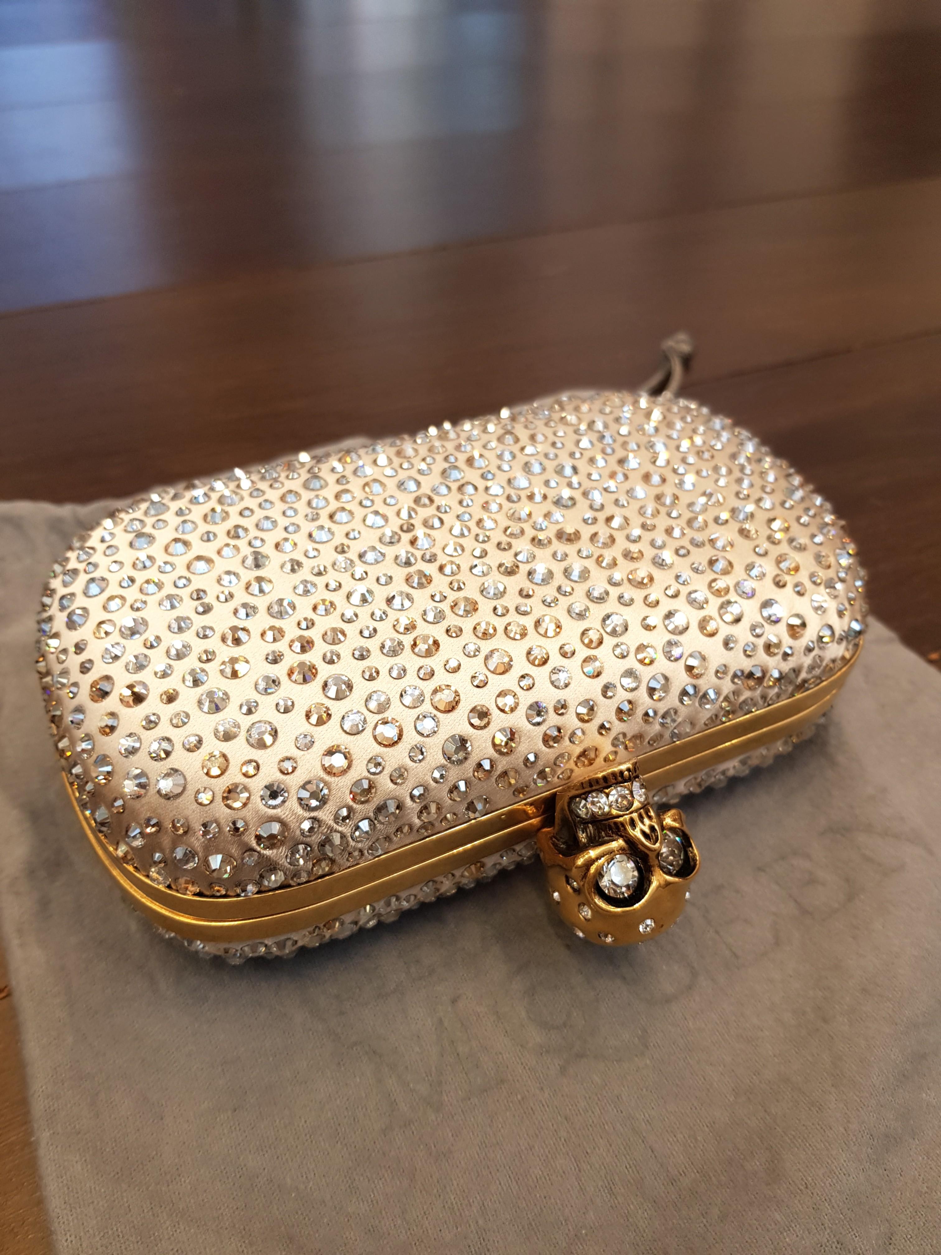 Alexander mcqueen gold clutch top