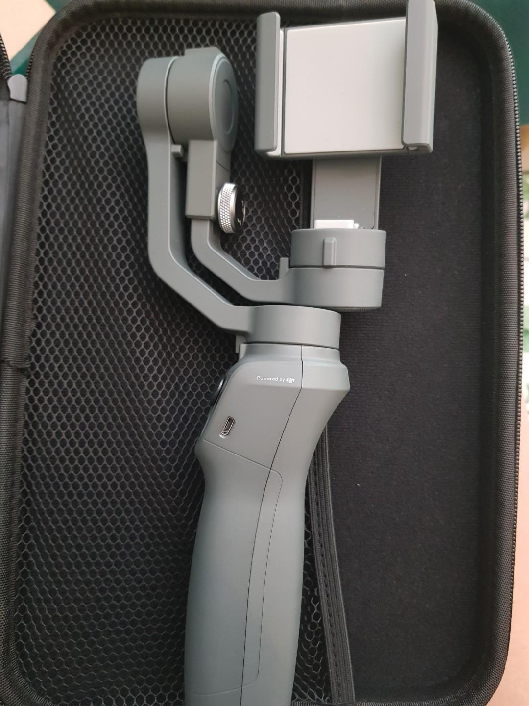 HOT SALE OSMO GIMBAL (Category: Mounts & Holders) located in Taguig. Submitted by ashloome (Listing ID 261730764, Image 3). Description: DJI OSMO Mobile 2 Osmo Gimbal, almost brand new, slightly used. Comes with a molded case. (Check picture) Original box not available. We left it in the US. More info about the item thru this link: https://www.dji.com/osmo-mobile-2 For pick-up, u may use lalamove or grab. Location: Taguig.
