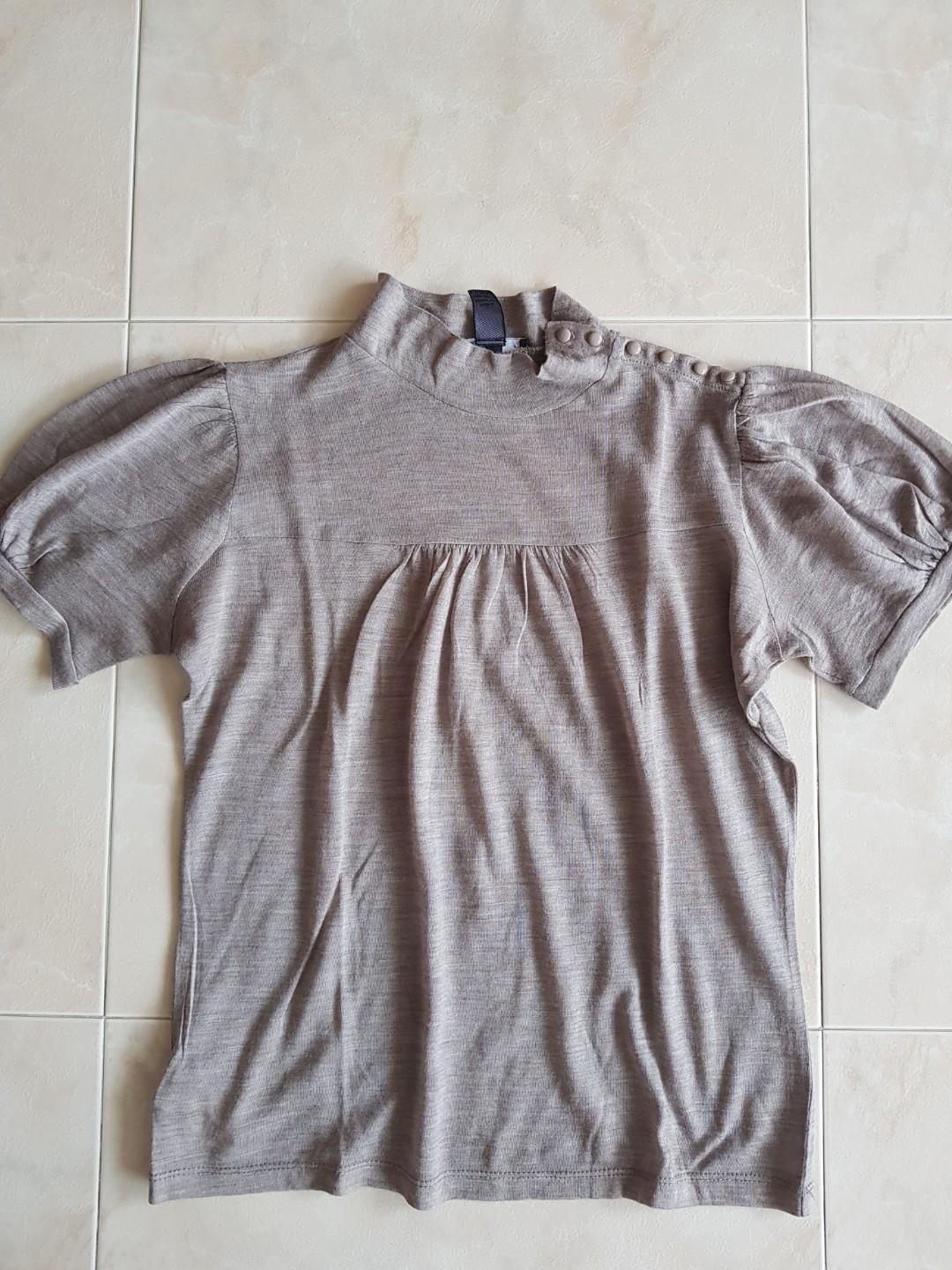 Mango top brown colour (Category: Blouses) located in Singapore. Submitted by chill_101 (Listing ID 262170708, Image 1). Description: Wardrobe clearance Wash but nvr wear before Size: see photos.