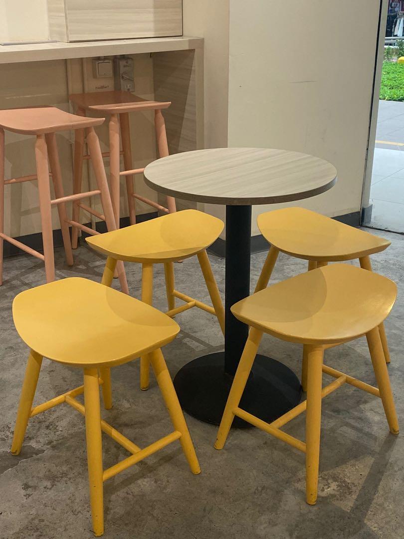 Table set (Category: Tables & Sets) located in Singapore. Submitted by bombelly (Listing ID 262177885, Image 1). Description: Small balcony/tea table and wooden chairs. Each set comes with 1 table and 2 chairs. Tables are custom made pieces with a clean, white wood laminate top that is easy to clean. Chairs come in 3 pastel colours: yellow, pink, baby blue. Original price of each chair is more than $80. Additional chairs at $15 each. .