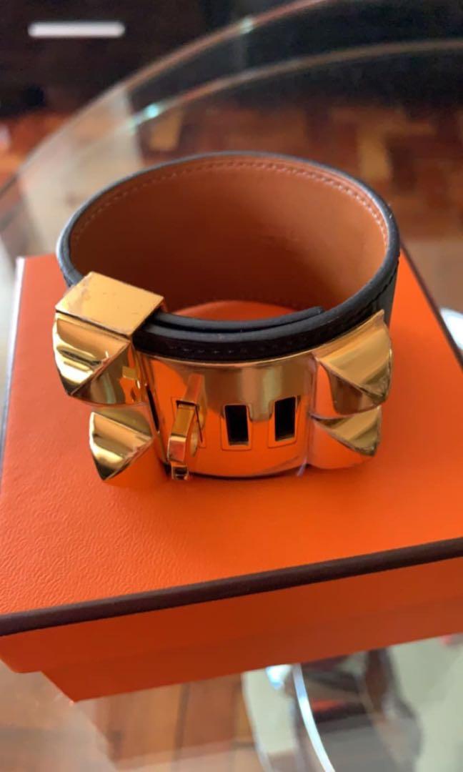 Authentic Hermes Collier de Chien Bracelet (Category: Luxury Accessories) located in Makati City. Submitted by organic_lemon (Listing ID 262257178, Image 3). Description: Pre-owned Authentic Hermes Collier de Chien Bracelet in box Calfskin with gold plated Medor pyramid studs and ring with plastic cover still intact, adjustable closure Wrist size approx. 7.5" Color noir .