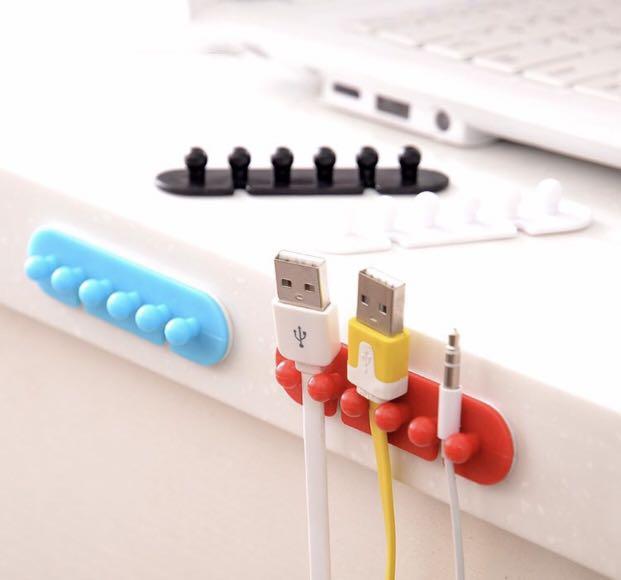 Cables and charger organizer plug holder (Category: Storage Boxes & Baskets) located in Manila. Submitted by hodlclub (Listing ID 262245139, Image 1). Description: 50 php each Just stick at the back. Ready to stick on your wall or desk Available in black or white .