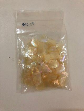 Translucent shell shaped sequins