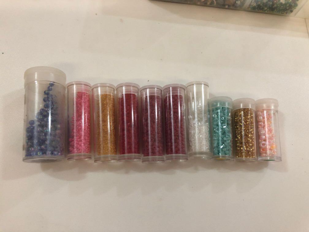 Assorted beads (Category: Craft Supplies & Tools) located in Singapore. Submitted by melvor (Listing ID 263261616, Image 1). Description: Price and description from left to right: Unicorn dark blue purple - $1.50 Shocking pink with clear outer shell - $1.50 Yellow gold - $1.50 Bright red - $1.50 Matte red x2 - $1.50 each White cylindrical - $1 Turquoise cylindrical - $1 Bright gold round - $1 Pastel pink large round - $0.50 $10 if you buy all. Pr