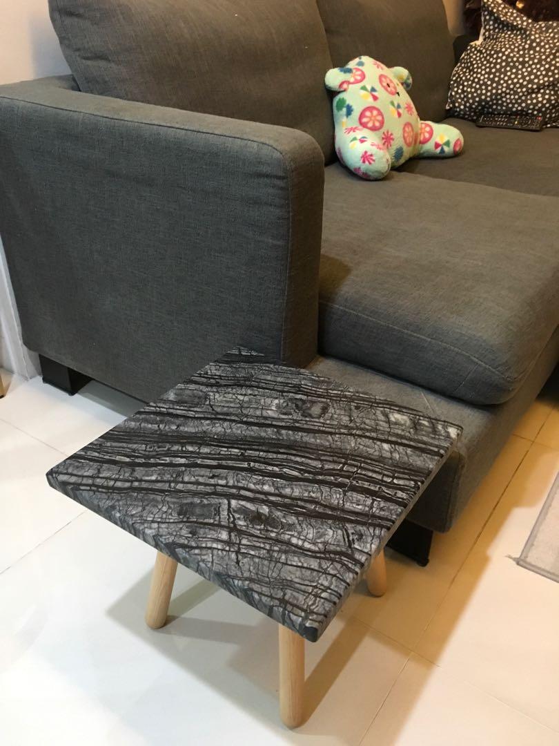 Marble side table (Category: Tables & Sets) located in Singapore. Submitted by wilson.wang.71653 (Listing ID 263267244, Image 1). Description: Got a brand new rare Black Forest marble table. Come with a small wooden stool base. Height 300mm size 400x400mm. 20mm thick Nice decor, bearbrick base, expensive marble coaster. .