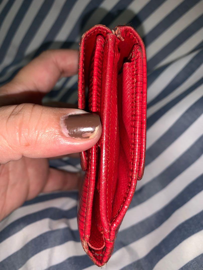 Authentic Louis Vuitton EPI compact wallet (Category: Luxury Bags & Wallets) located in Quezon City. Submitted by luxuryphloved (Listing ID 261078863, Image 2). Description: Authentic Louis Vuitton compact wallet With serial number/ serial code Good used condition Peeling inside but not sticky.