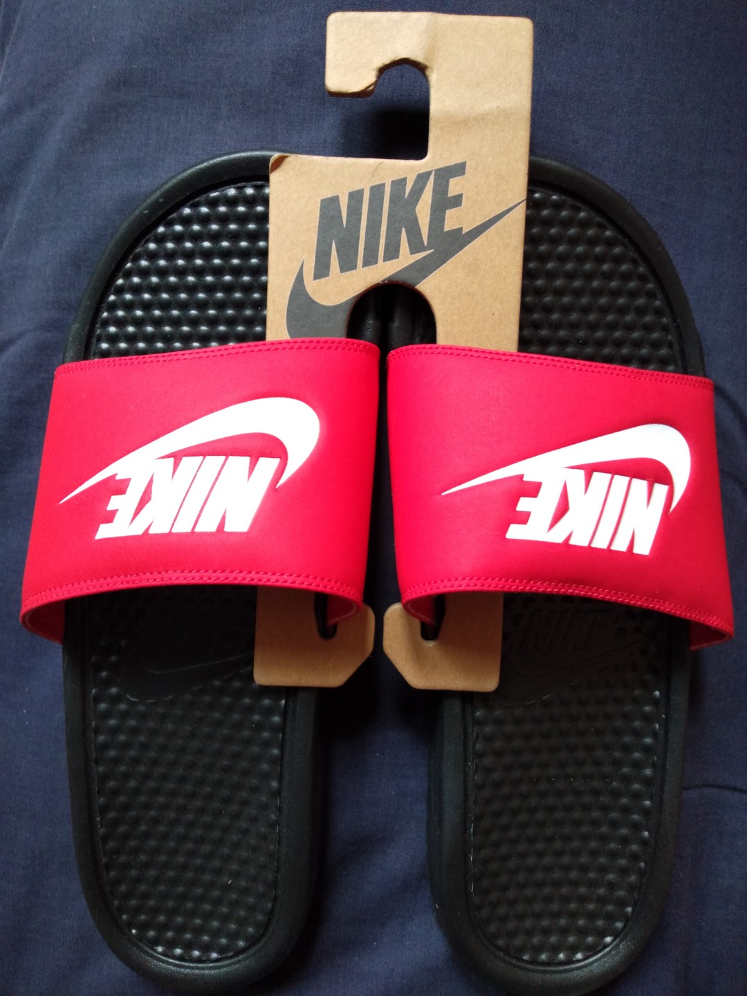 red and black nike slippers