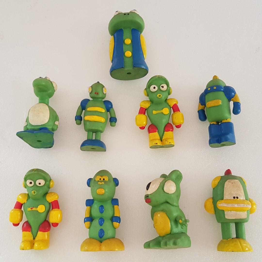 Get Wallpaper A Set Of 9 Action Figures Green Aliens In Different Shapes And For Free