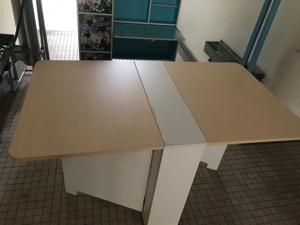 Foldable Dining Table (Category: Chairs) located in Kuala Lumpur. Submitted by winnie_chong (Listing ID 264940976, Image 1). Description: - Still in good condition - Measurements: Length ~ 140cm Height ~ 78cm Width ~ 80cm (When opened) / 23cm (When closed) - Please refer to pictures in the advertisement for actual condition of the table ie: 1. Replaced one of the hinges before 2. One of the latch is not working .