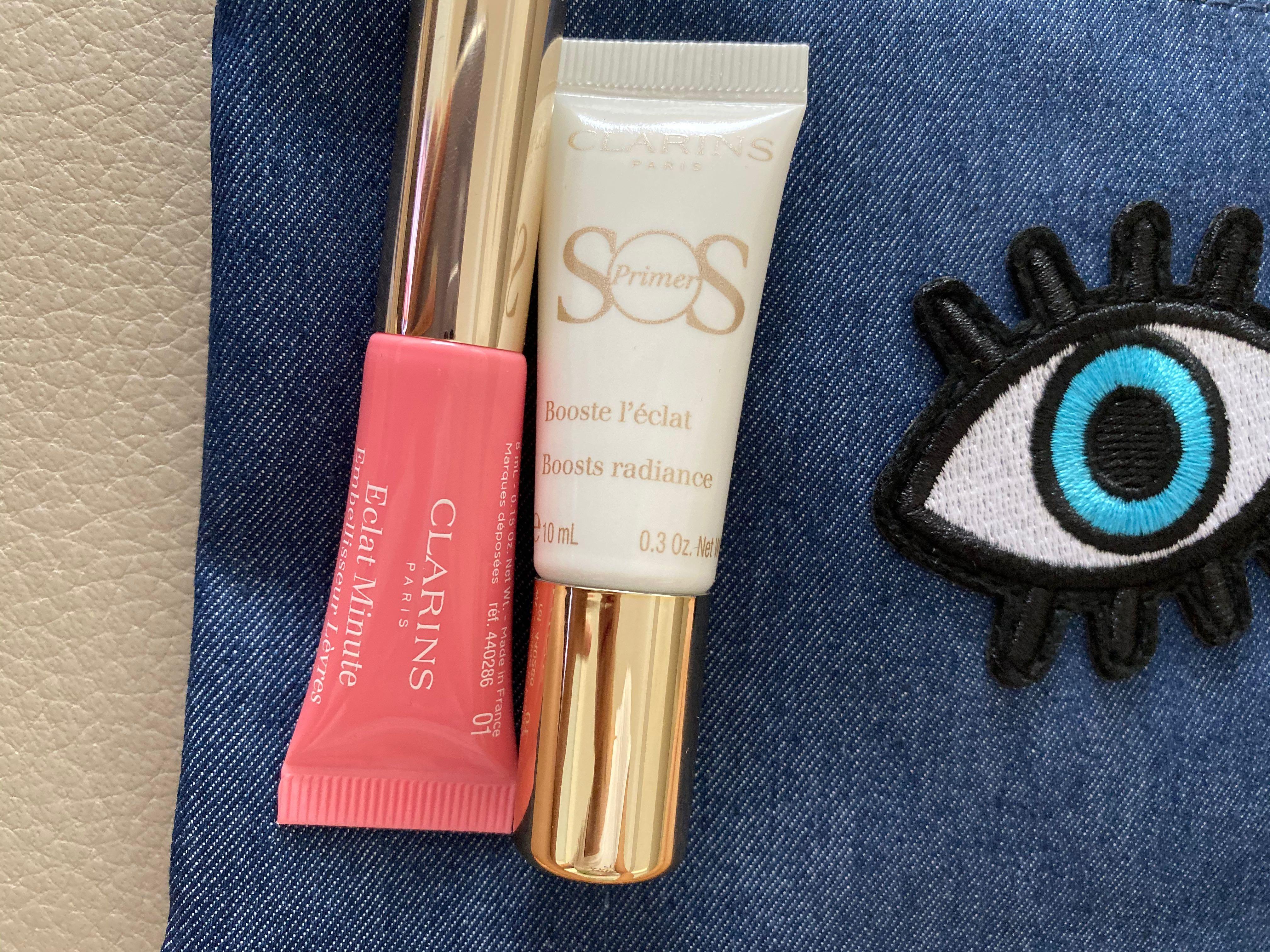 Clarins SOS primer and Lip Perfector with Clarins make up purse