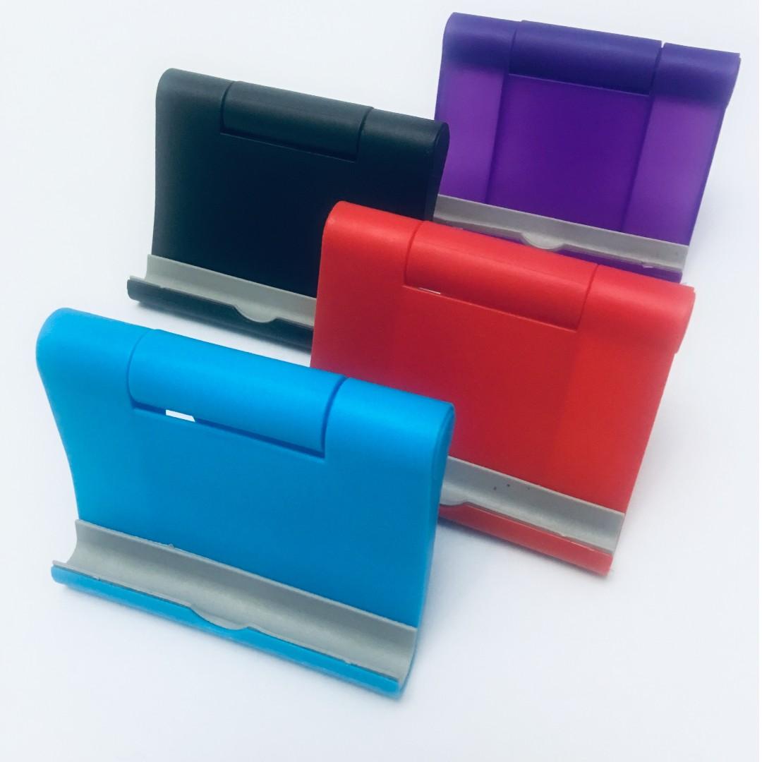 Gwen's Adjustable Phone Tablet Holder (Category: Mounts & Holders) located in Quezon City. Submitted by gwenswonderfulboutique (Listing ID 265381440, Image 1). Description: Gwen's Adjustable Portable Phone Tablet Holder Stand - For Android and Apple Phones and Tablets - Cool and Foldable Design - Portable / Easy to Carry - For Phone and Tablets Choose from our available colors: Black, Blue, Red, Violet We do meetup: @ Cubao Farmer's Mall or Shell