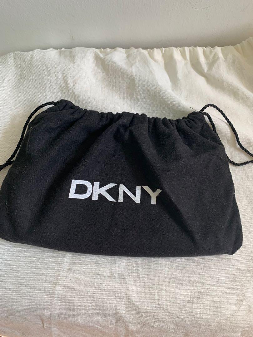 Authentic DKNY wallet (Category: Luxury Bags & Wallets) located in Batangas. Submitted by shop_pinkaholics_closet (Listing ID 266227182, Image 2). Description: Authentic DKNY long wallet Good condition Gently used With dust bag .
