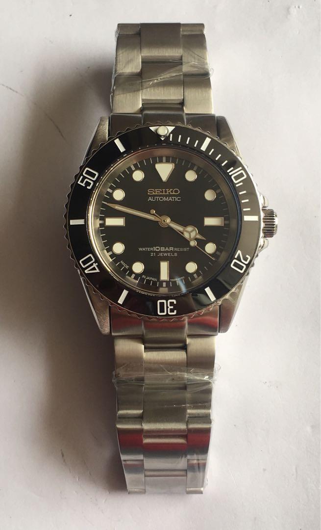Seiko 10Bar SKX031 No-Date Black Ceramic Modified, Men's Fashion, Watches &  Accessories, Watches on Carousell