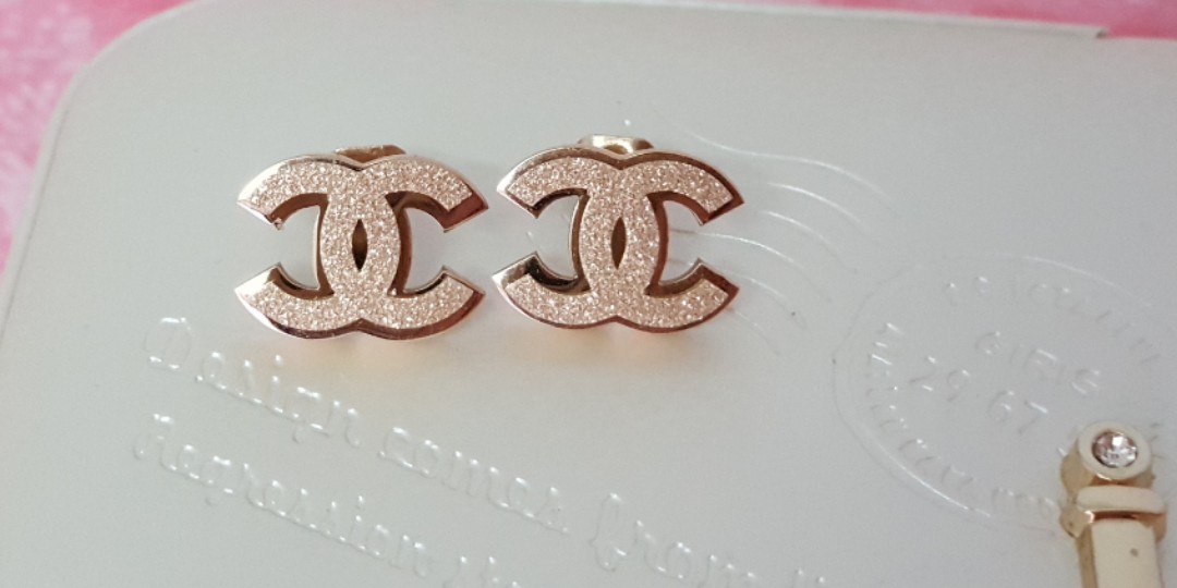 Lot  Sterling silver and rose gold plated Chanel design ear studs
