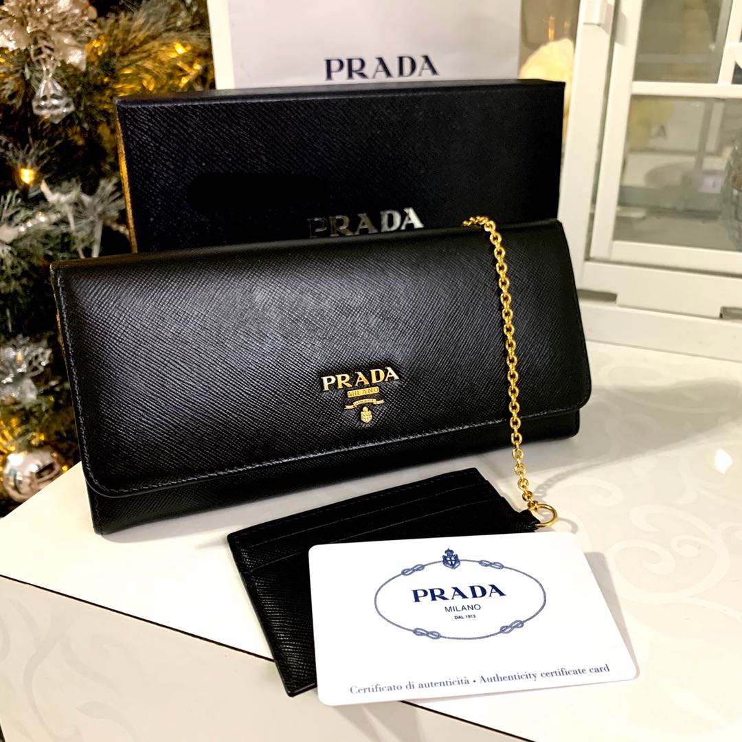 Prada saffiano leather mini pouch with strap chalk white with silver  hardware, Luxury, Bags & Wallets on Carousell