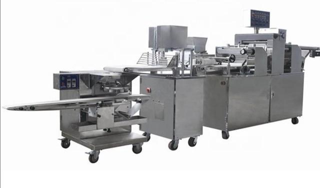 Automatic bread filling machine (Category: Others) located in Puchong. Submitted by cocoque (Listing ID 267978322, Image 2). Description: Like new. Only used for few trials. Bread filling machine with 2 stuffing. Bun forming. Bread production. Have other bread production machine for sale too. Contact me.