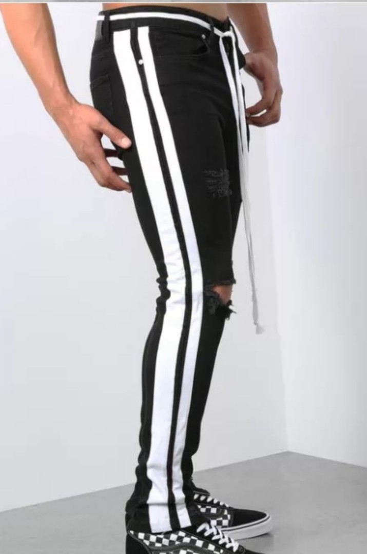 Black ripped jeans with zip and white stripes