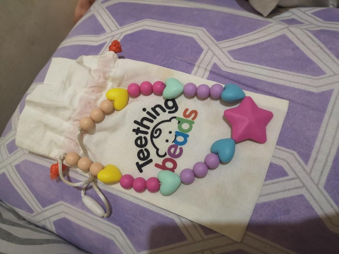 Baby Teething Beads (Category: Weaning & Toddler Feeding) located in Pasig City. Submitted by aronlinebazaar (Listing ID 268328795, Image 1). Description: Baby Teething Beads Used few times then stored. Very classy and cute for babies. Washable. MOP: BDO/BPI/GCASH Sf c/o buyer.