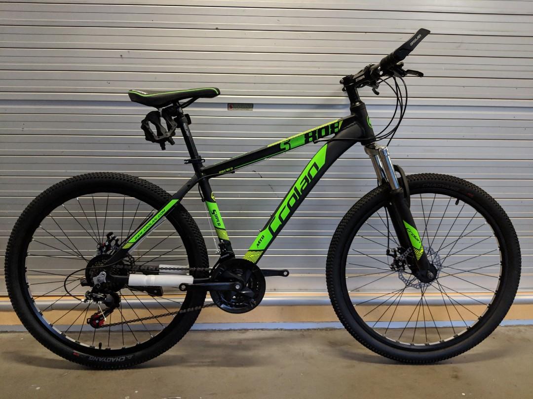 green and black mountain bike