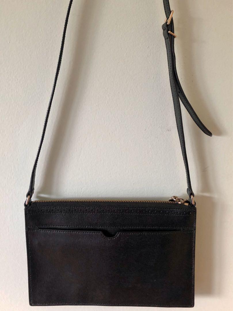 Cole Haan Black Crossbody Bag (Category: Cross-body Bags) located in Antipolo. Submitted by drfernandez (Listing ID 268732897, Image 3). Description: Cole Haan Small Black Crossbody with gold hardware and adjustable strap. Perfect rectangular shape. Measures about 9 1/4" across x 6" in height x 1" deep. All edges including the strap's edges are intact. In excellent used condition. This comes from a smoke-free and clean home. Please check my listi