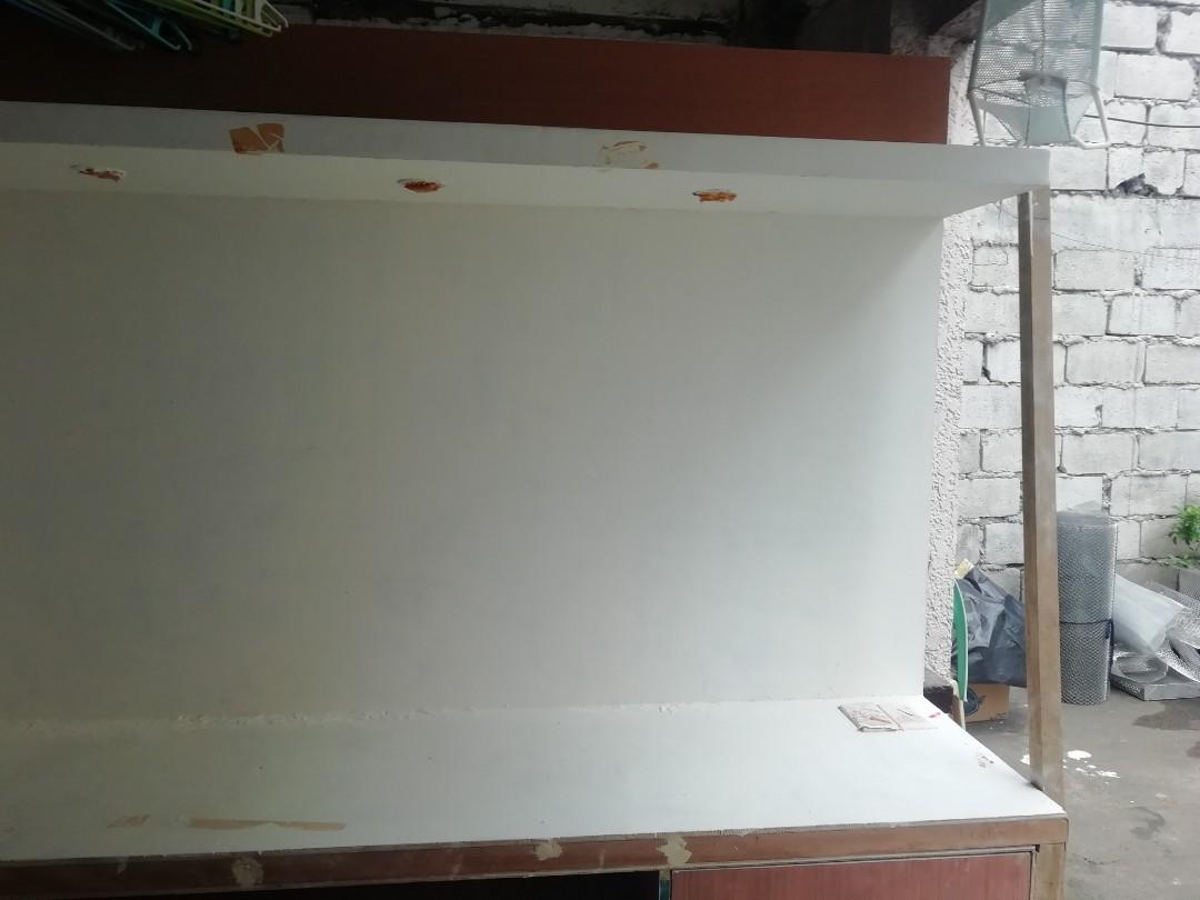 Media Console (Category: TV Consoles) located in Quezon City. Submitted by kimpossibleme (Listing ID 269298481, Image 1). Description: Dimension: 240x200x50 cms. With switch, outlet and 3 lights. Spent almost 20k for this. Started painting it with lacquer putty and paints. Selling because wala ng magtatapos ng pag paint and other finishing touches like hardwares. This is quite heavy so for pick up only. Cubao area. PS. Excuse the photos, these ar
