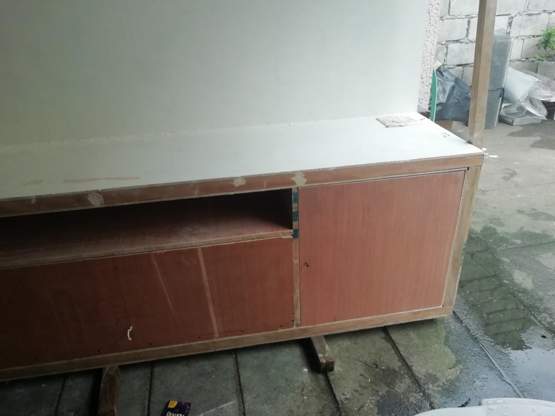 Media Console (Category: TV Consoles) located in Quezon City. Submitted by kimpossibleme (Listing ID 269298481, Image 2). Description: Dimension: 240x200x50 cms. With switch, outlet and 3 lights. Spent almost 20k for this. Started painting it with lacquer putty and paints. Selling because wala ng magtatapos ng pag paint and other finishing touches like hardwares. This is quite heavy so for pick up only. Cubao area. PS. Excuse the photos, these ar