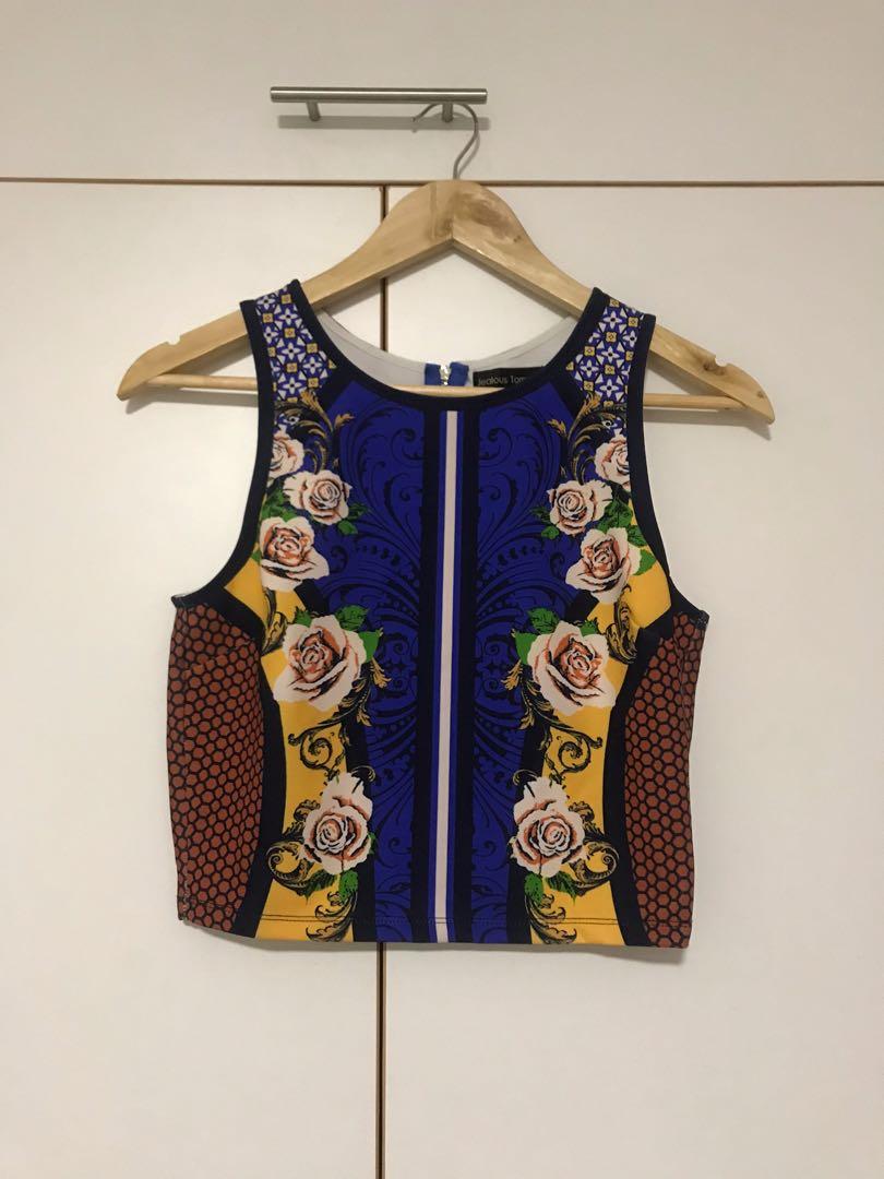 Authentic patterned sleeveless top (Category: Sleeveless) located in Cebu City. Submitted by lux_declutter (Listing ID 270577226, Image 1). Description: Authentic jealous tomato Sleeveless top Retails for $25 Used once. Looks good with midi skirt or palazzo pants Size M. But fits Small - Medium frames. .