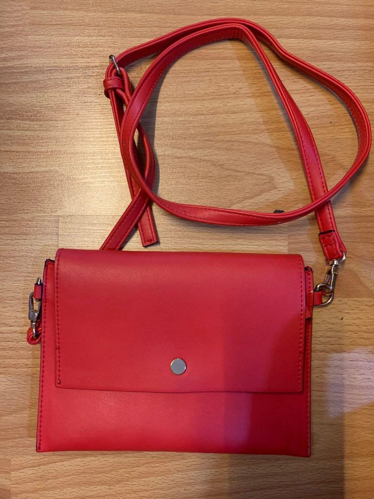 Mark’s&Spencer Red Sling Bag (Category: Cross-body Bags) located in Mandaluyong City. Submitted by hellothere98 (Listing ID 270645392, Image 1). Description: Brand: Mark’s and Spencer Material: Faux Leather.