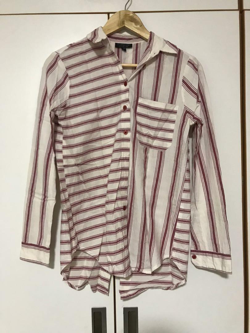 Pink stripe button down (Category: Blouses) located in Cebu City. Submitted by lux_declutter (Listing ID 270579850, Image 1). Description: Button down. Back side has a slit Nice for the beach. Has a little stain but not noticeable since you’ll fold the sleeves .
