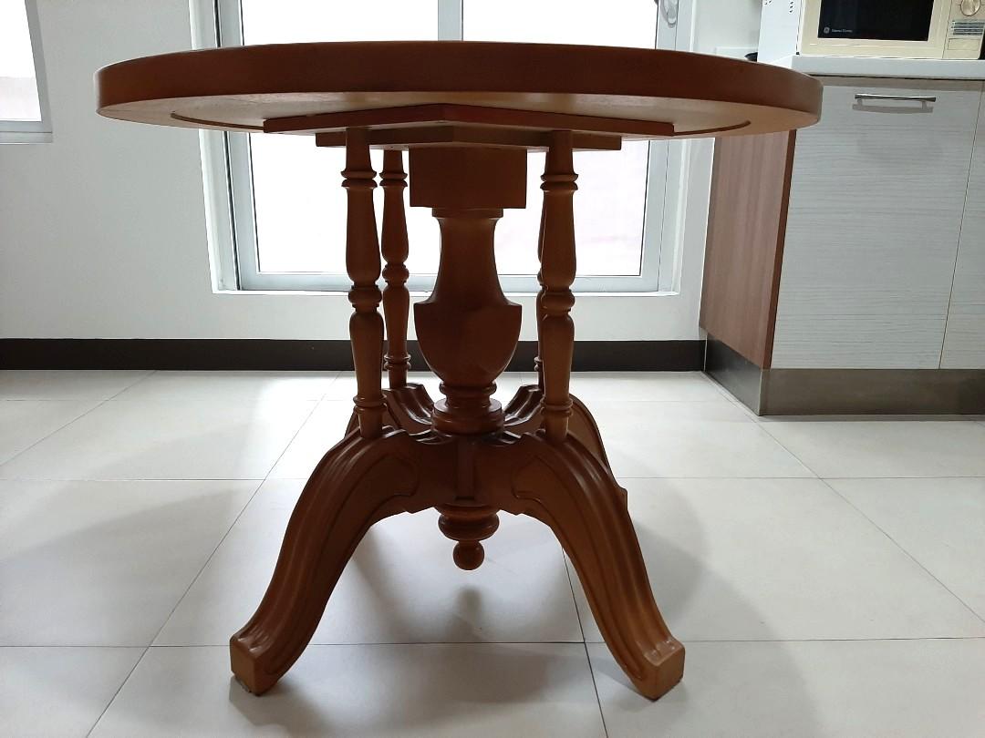 Coffee table / small dining table / study table (Category: Tables & Sets) located in Quezon City. Submitted by maki1505 (Listing ID 270989709, Image 1). Description: Solid wood Recently repainted No scratches Intricate design Very sturdy Can be used as your morning coffee table or dining table or as your children's study Dimensions Height 29inches Diameter 36inches.