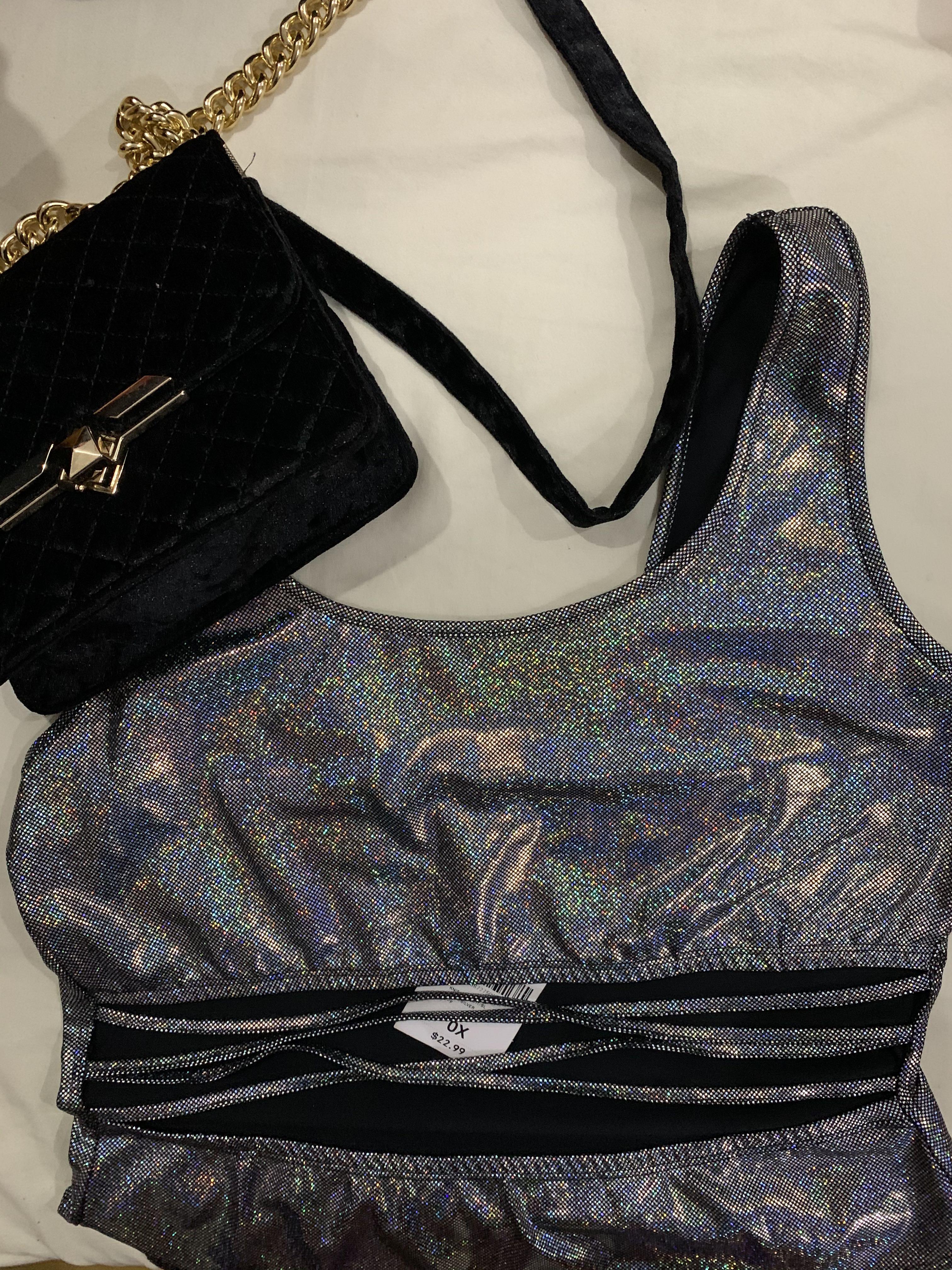 Forever 21 Iridescent Bodysuit (Category: Sleeveless) located in Taguig. Submitted by impulsivemoims (Listing ID 271236211, Image 1). Description: Authentic Forever 21 Iridescent Bodysuit PLUS SIZE Knit bodysuit featuring an iridescent design, scoop neck, strappy midriff cutout and a thong bottom. Size: 0X (fits L-XXL Color: Black/Silver Condition: 10/10 BRAND NEW WITH TAGS Super cool Rave/Edgy look 😍😍😍 RFS: Doesn’t fit Original Price: 1100 pl