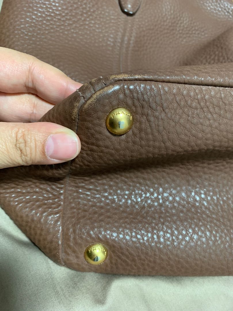 Auth Prada tote bag brown [leather Tory Burch gucci] (Category: Tote Bags) located in Singapore. Submitted by mstham_23 (Listing ID 271448360, Image 3). Description: Condition as shown in photo, slight wear at the corner but not that visible. View and decide! Comes with Prada dust bag Viewing possible at my Blk !:72!;$2!,3&!3.