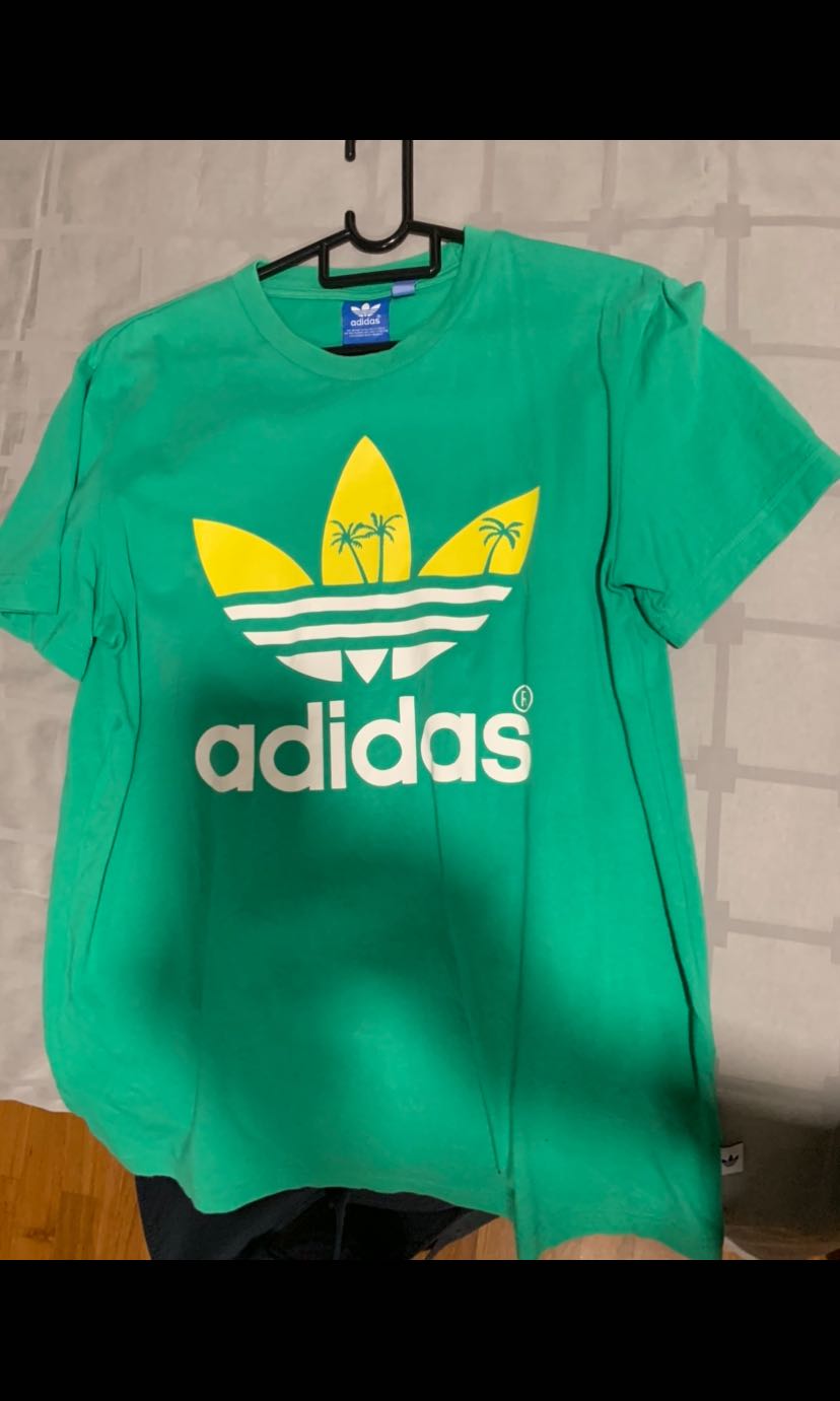 blue and green adidas shirt