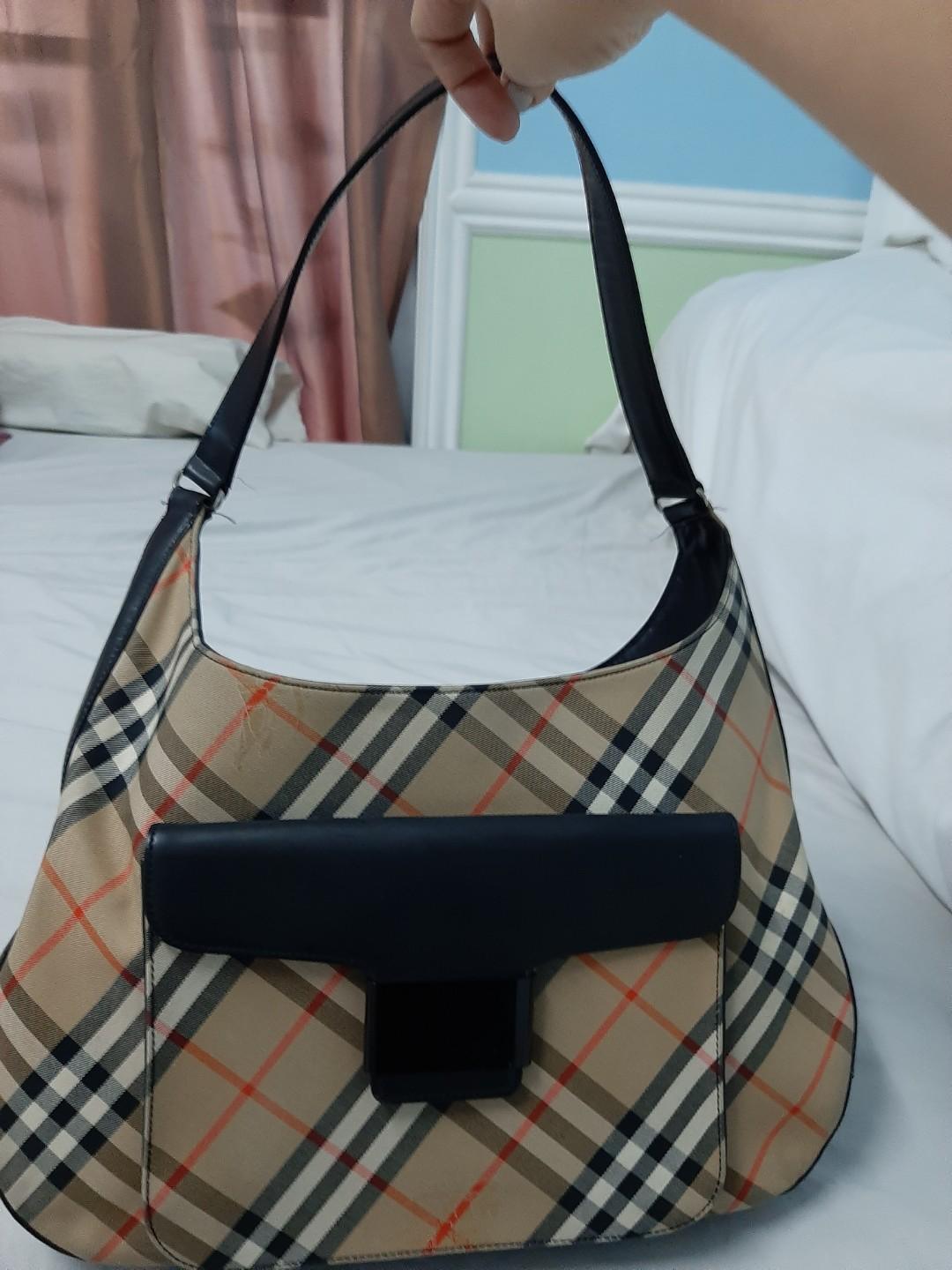 Burberry Bag Guaranteed Authentic (Category: Luxury Bags & Wallets) located in Paranaque City. Submitted by andim8 (Listing ID 272125059, Image 1). Description: Burberry Bag with dustbag guaranteed authentic. Cobdition vgood some scuffing under the front pocket flap only. All external and internal parts all in good condition :).
