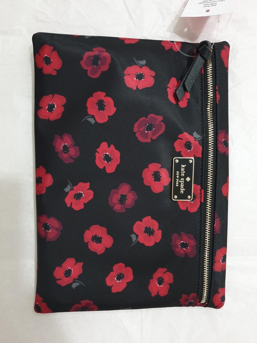 Repriced! Kate Spade Clutch (Category: Clutches) located in Pasig City. Submitted by rokels_locker (Listing ID 272413506, Image 1). Description: -Kate Spade New York Wilson Road Large Drewe Clutch - front zipper closure -Embossed black/gold toned brand name logo in front -Approx. dimensions: 10 in (L) x 7.25 in (H) x 0.5 in (W).