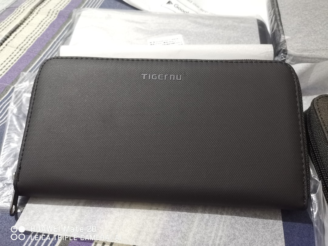 TigerNu wallet unisex (Category: Wallets & Card holders) located in Manila. Submitted by jhane23 (Listing ID 272706858, Image 2). Description: PRODUCT SIZE AND OTHER DETAILS ARE IN THE PICTURES and Product Name. PLEASE CHECK FIRST BEFORE ASKING. THANK YOU :) Selling unisex wallet Brand: TigerNu Model: T-S8081 Colors: TPU black & OXFORD brown Material: splashproof External size: 21.5 x 1.5 x 11.5cm Net weight:0.2Kg Just swipe the picture for actua
