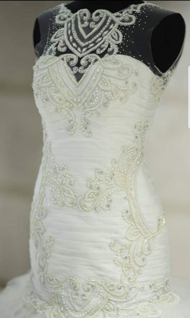 Wedding Gown (Category: Evening dresses & gowns) located in Cainta. Submitted by jgbags (Listing ID 272881028, Image 2). Description: Wedding gown bought for 60,000 PHP Long trail can be folded into a shorter gown for reception. Fits size 2-4 or small frames.