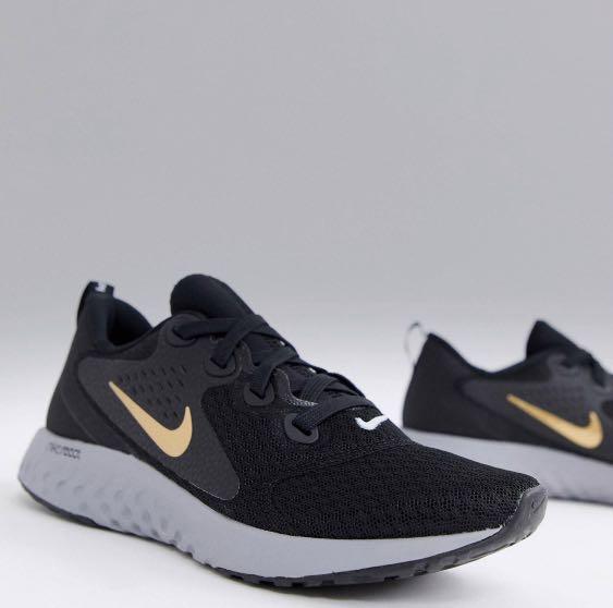 nike legend react black and gold