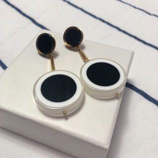 Black and White Circular Dangly Earrings with Gold Accents