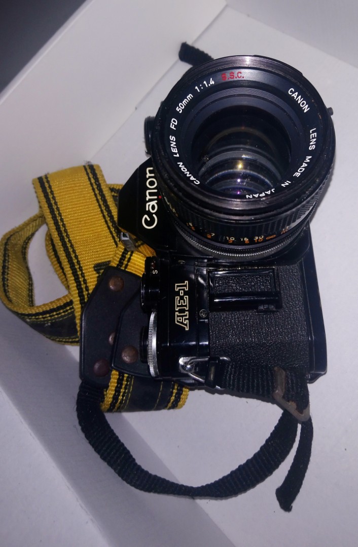 Canon SLR AE1 manual film camera with accessories., Photography