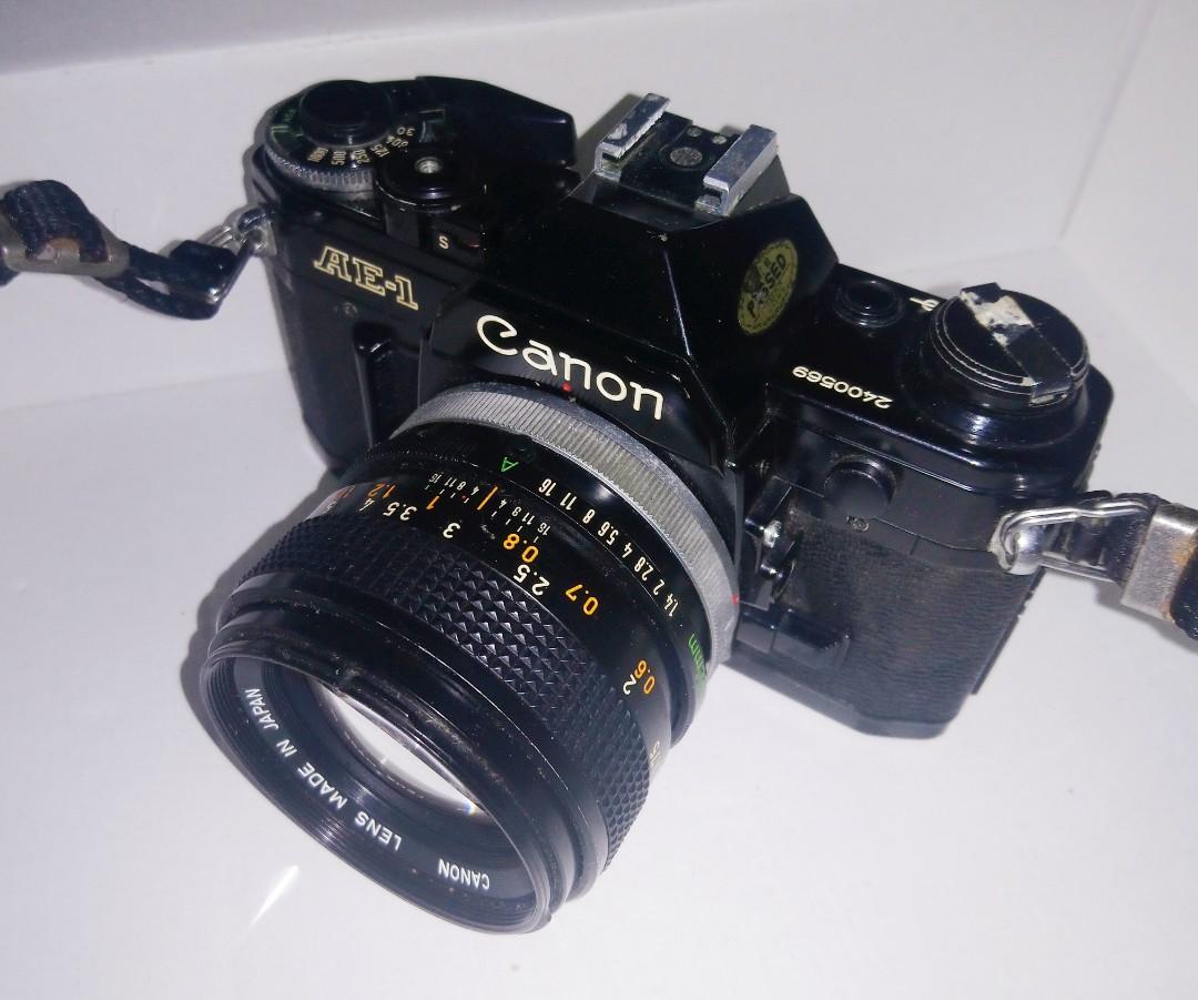 Canon SLR AE1 manual film camera with accessories., Photography