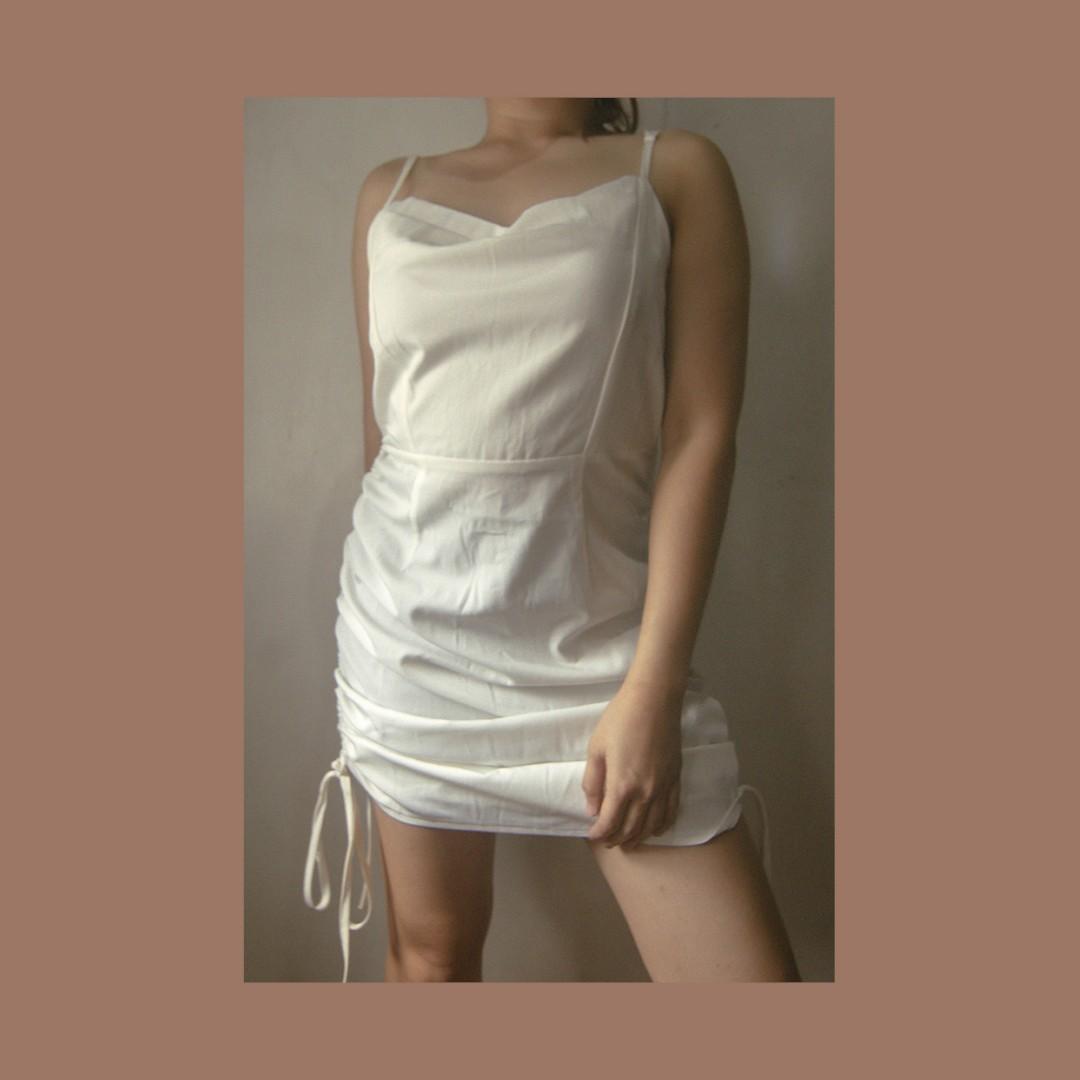 White Semi-cowl Ruched Dress (adjustable length) (Category: Dresses) located in Manila. Submitted by bkcee (Listing ID 273853811, Image 1). Description: NEW AND UNUSED (Used for when worn photo only) *Adjustable straps *Bust: 32-36" *Waist: 13" (With thin garter at the back of the waist, fits 25-29/30") *Length: 40" (Adjustable side lengths - mini or midi) *Free size *Height on the photo: 4'11, waistline between 27-28 inches Perfect for XS-M fram