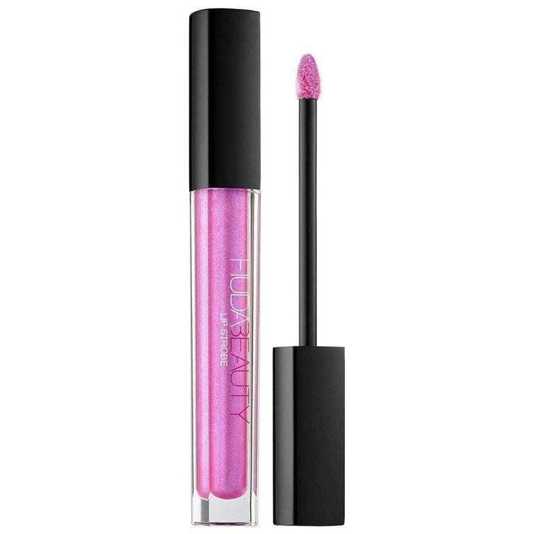 Huda Beauty Lip Strobe Mystical (Category: Makeup) located in Manila. Submitted by memorylanestore (Listing ID 274318408, Image 1). Description: The Hudabeauty Lip Strobe is a collection of Strobing Metallic Lip Glosses from sheer to full coverage designed to be worn alone or combined with your favorite lipstick. Try Mystical for a semi-sheer lilac base with blue pearls! Ultimate add-on to your lip game, the HUDA BEAUTY Lip Strobe proposes a vers