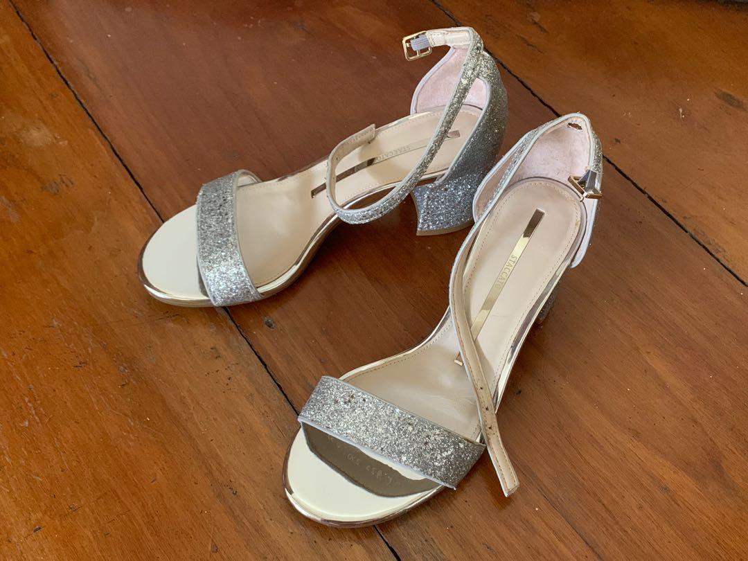 Staccato Silver Glitter Sandals (Category: Heels) located in Quezon City. Submitted by pingtbl (Listing ID 274307542, Image 1). Description: Bought in Hong Kong and used only once for a special occasion. Still in excellent condition. Actual size is US 6.5 / 23cm. Heel height is approx 6cm. Comes with 1 dust bag but no box..